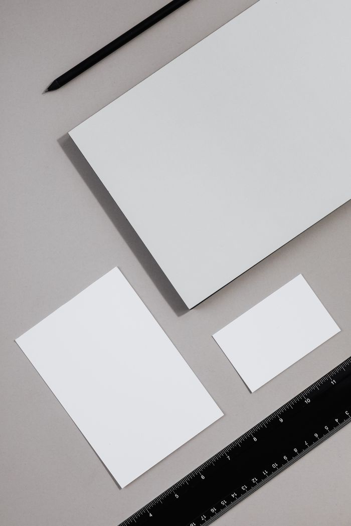 Home Top view of blank stationery items on a neutral background, perfect for design mockups.